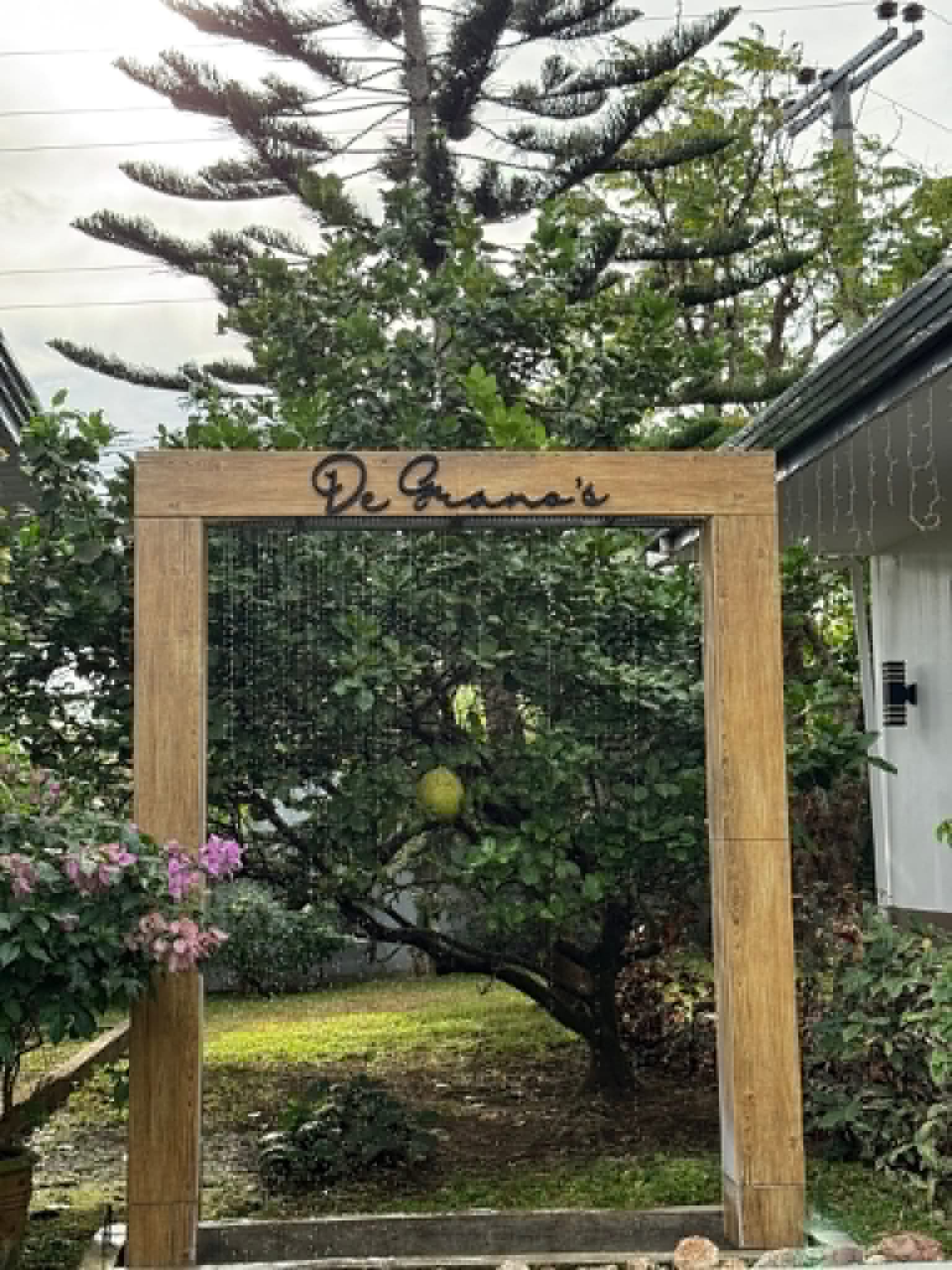 Villa 1 entrance sign and garden plants