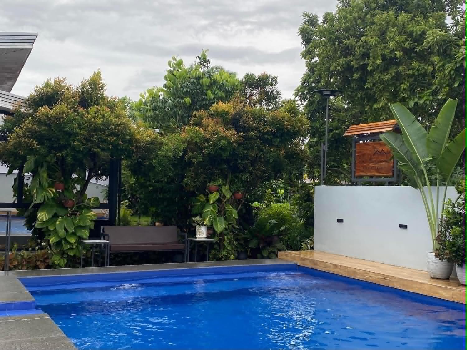 Villa 1 swimming pool with garden seating