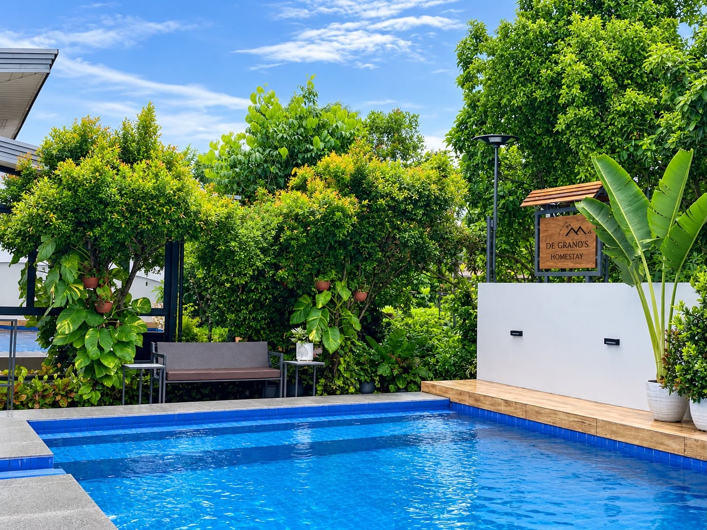 Villa 1 swimming pool surrounded by lush tropical gardens