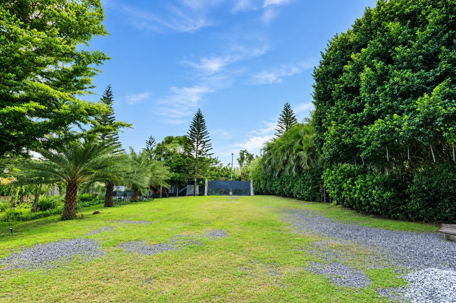 Main entrance and landscaped arrival grounds of De Grano's Homestay