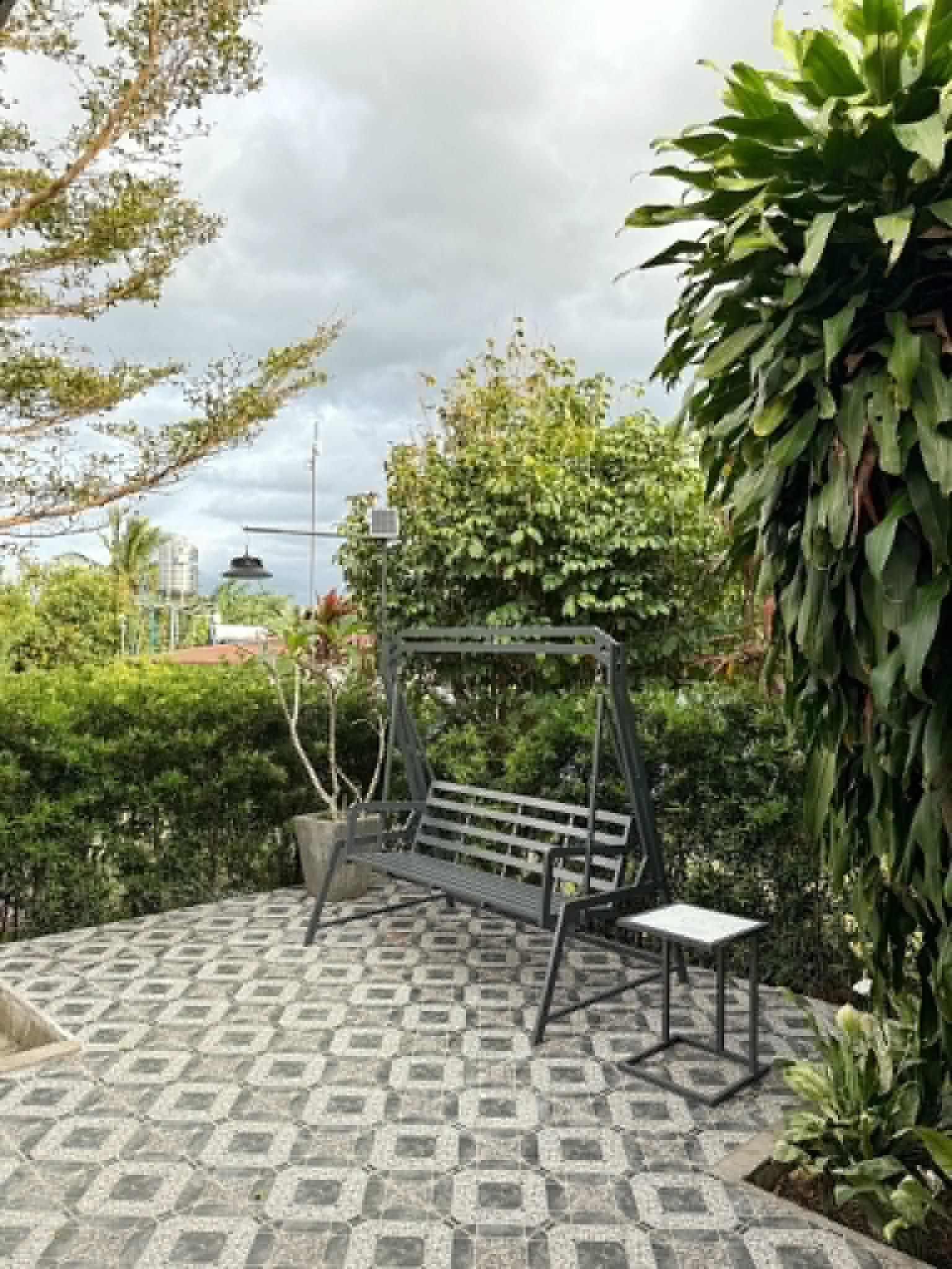 Villa 1 patio seating by the garden