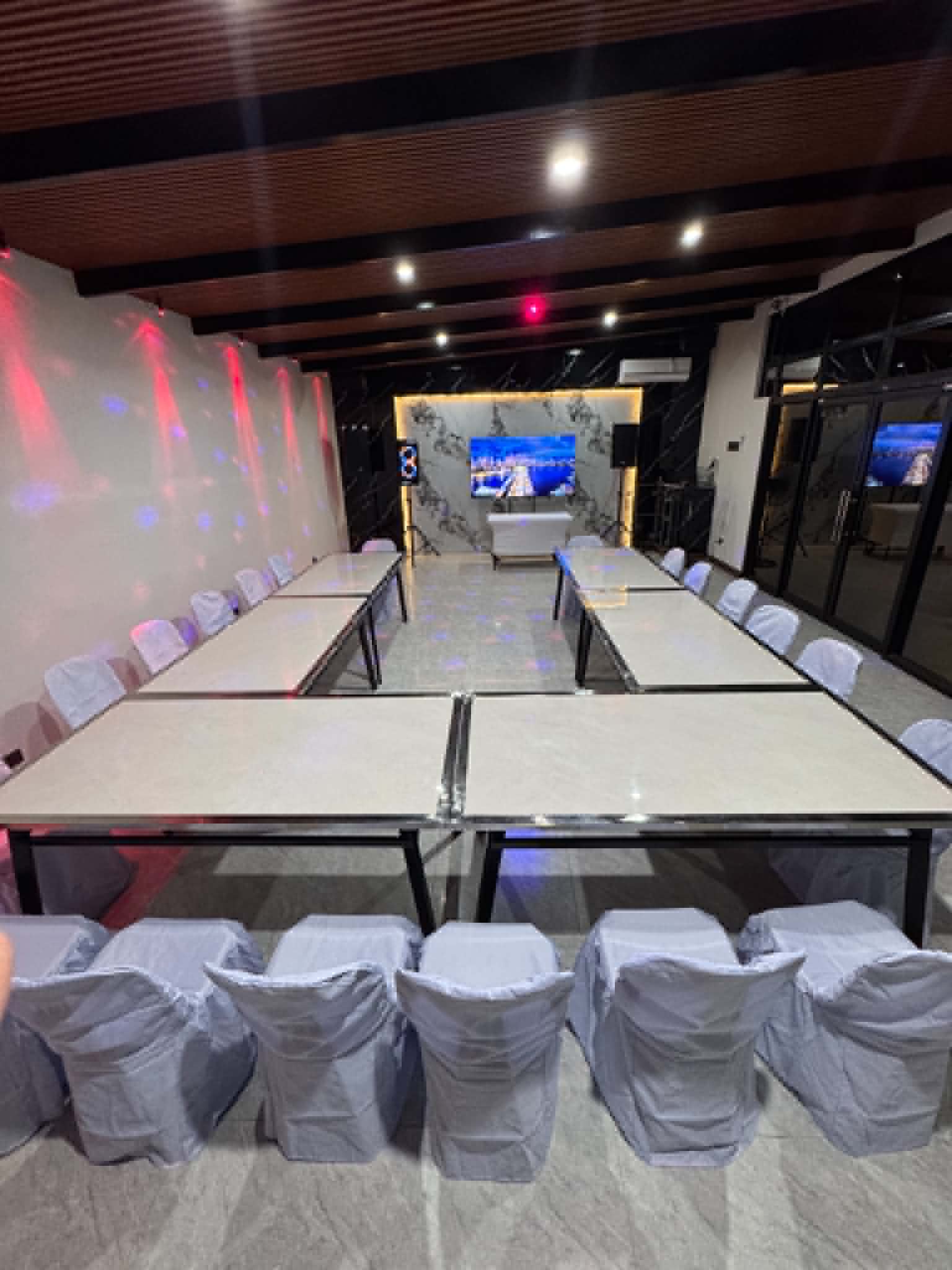 Villa 1 function room with tables and party lights