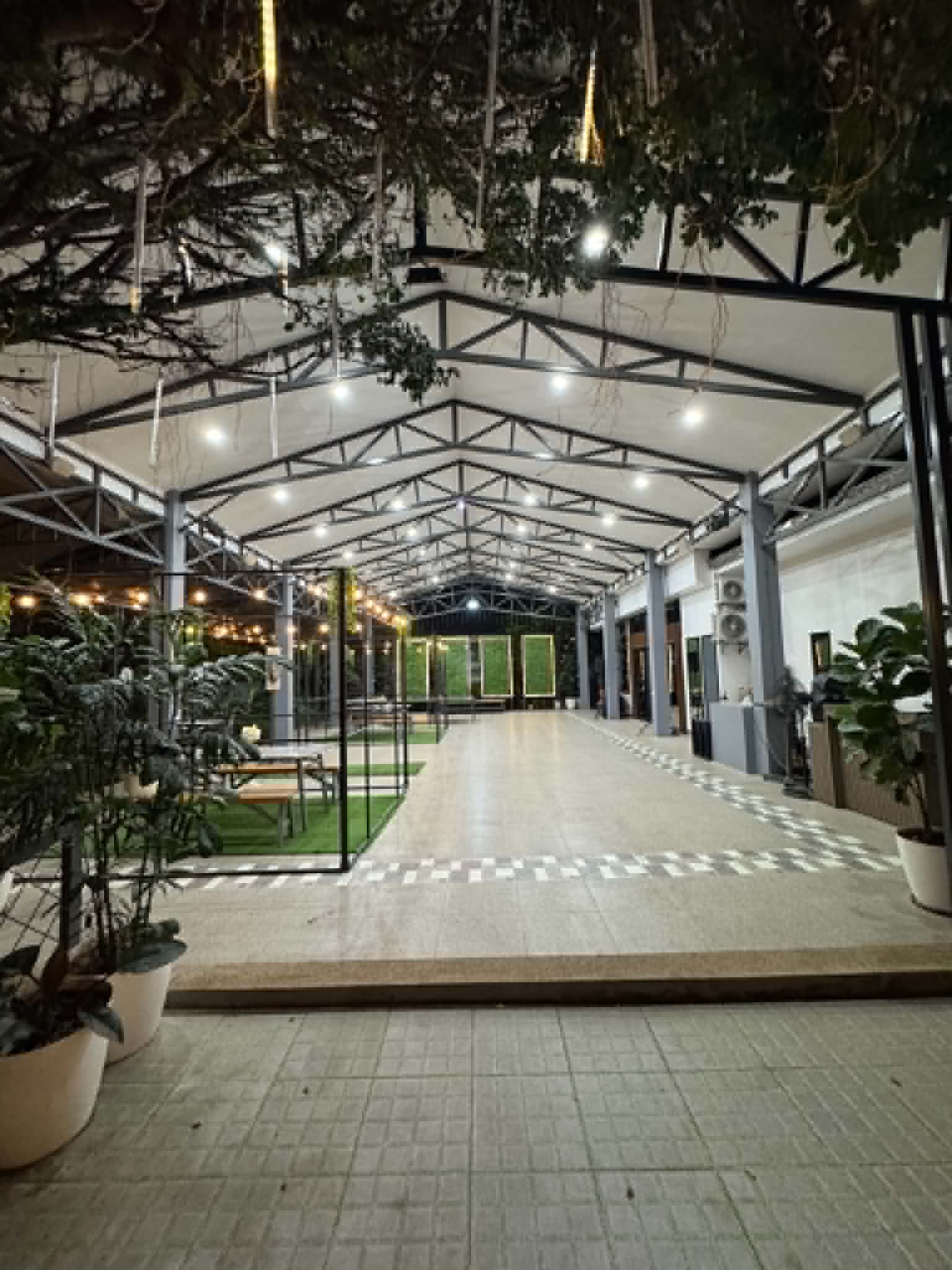 Villa 1 covered pergola walkway at night