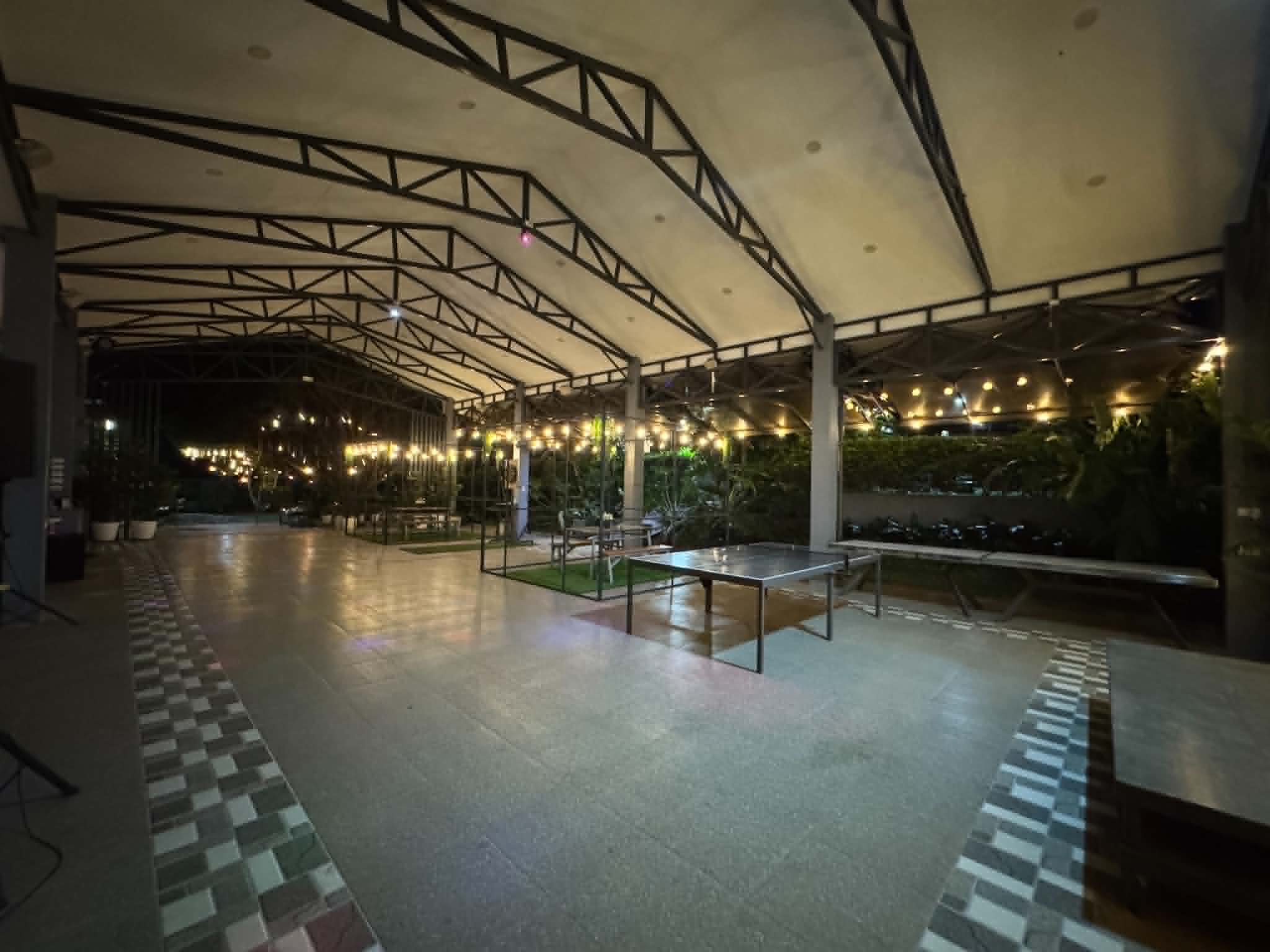 Villa 1 covered activity area with table tennis at night