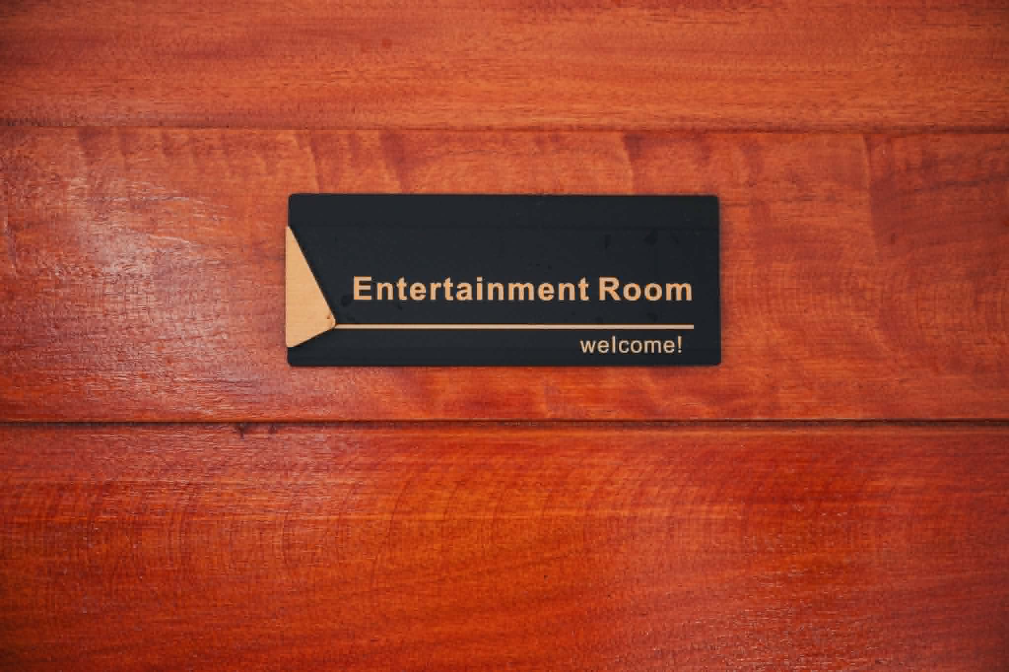 Villa 2 entertainment room sign on wooden door
