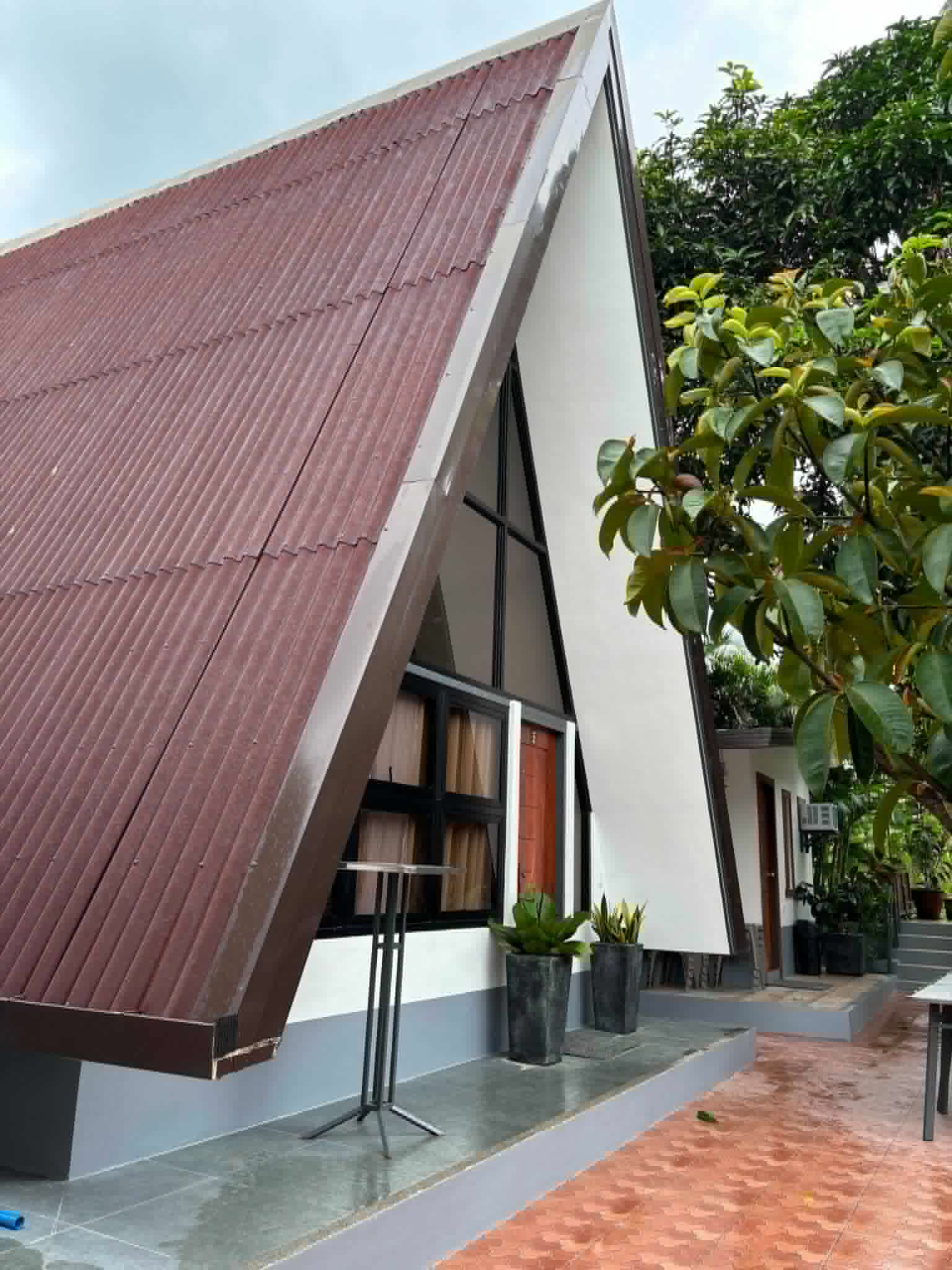 Villa 2 A-frame cabin exterior in daylight