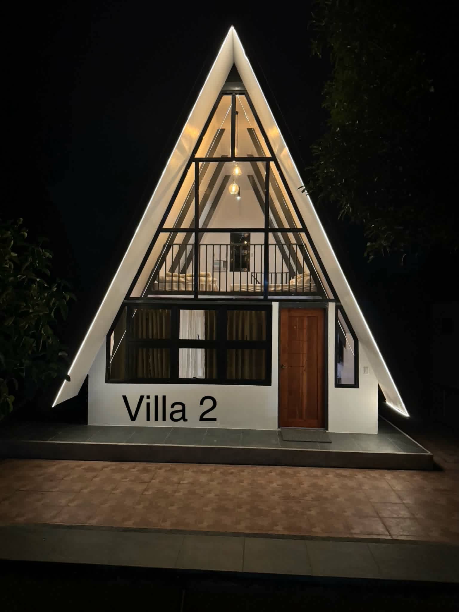 Villa 2 A-frame exterior lit at night