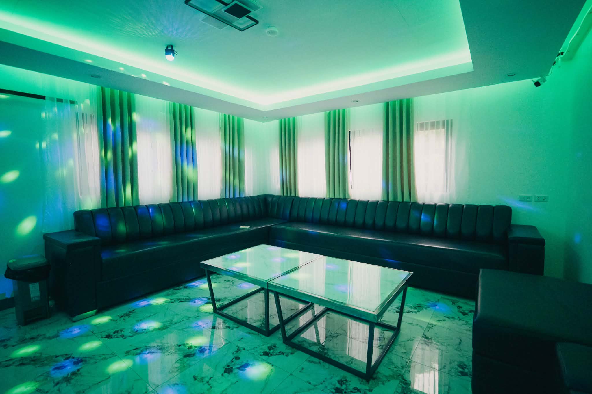 Villa 2 entertainment room sofa lounge with table and ambient lights