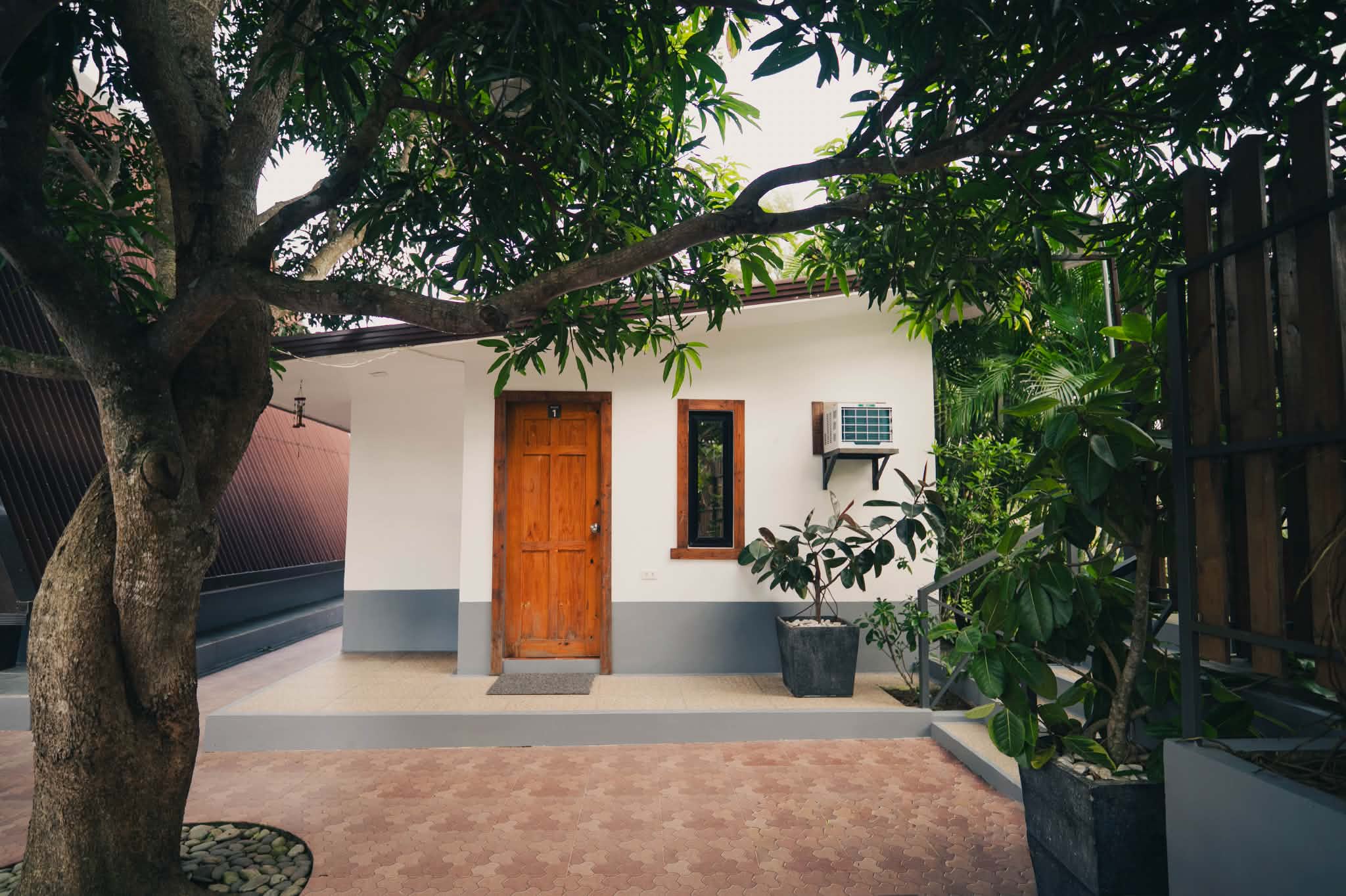 Villa 2 standard room exterior entrance with garden plants