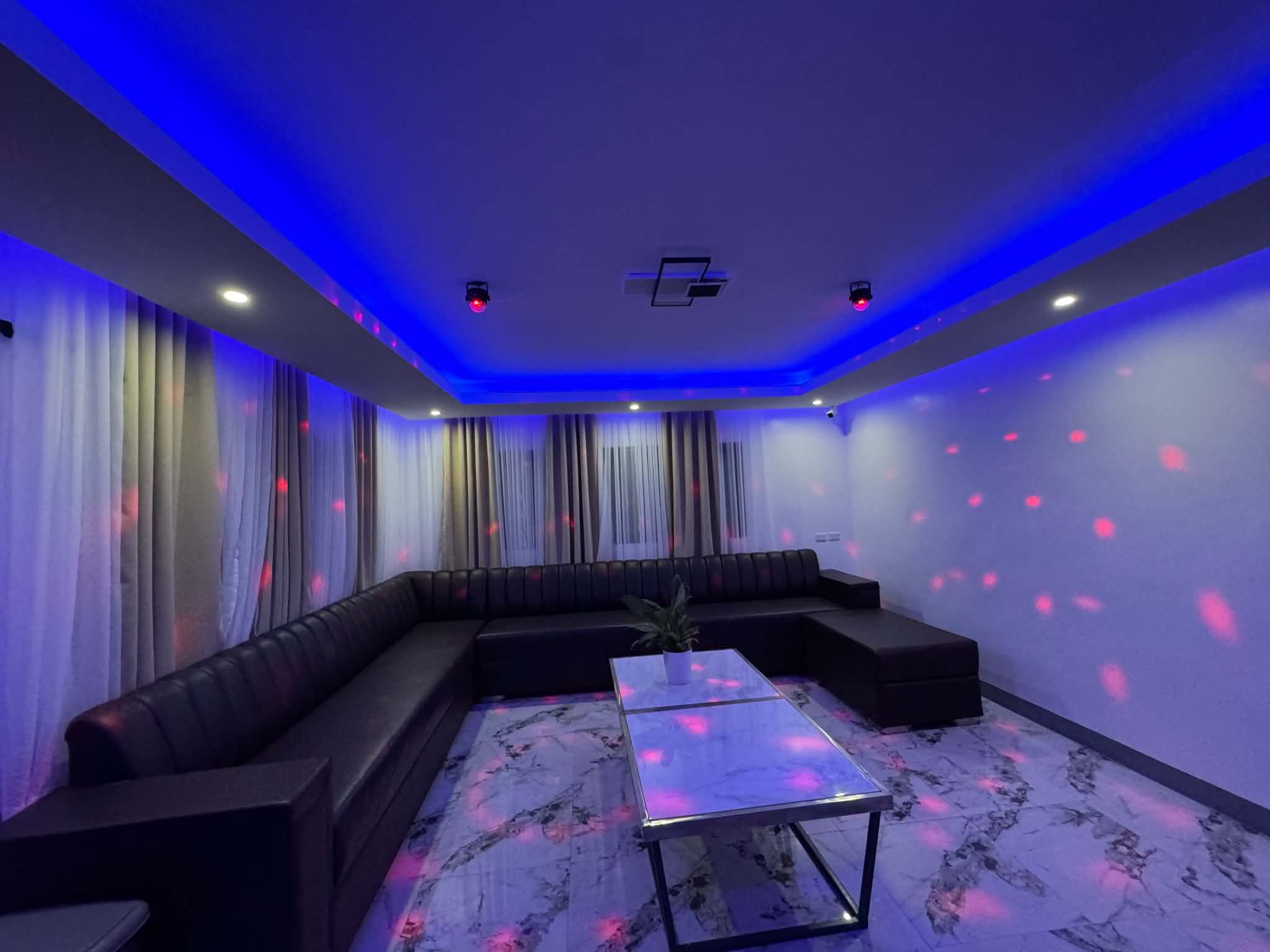 Villa 2 lounge seating with blue ceiling lights
