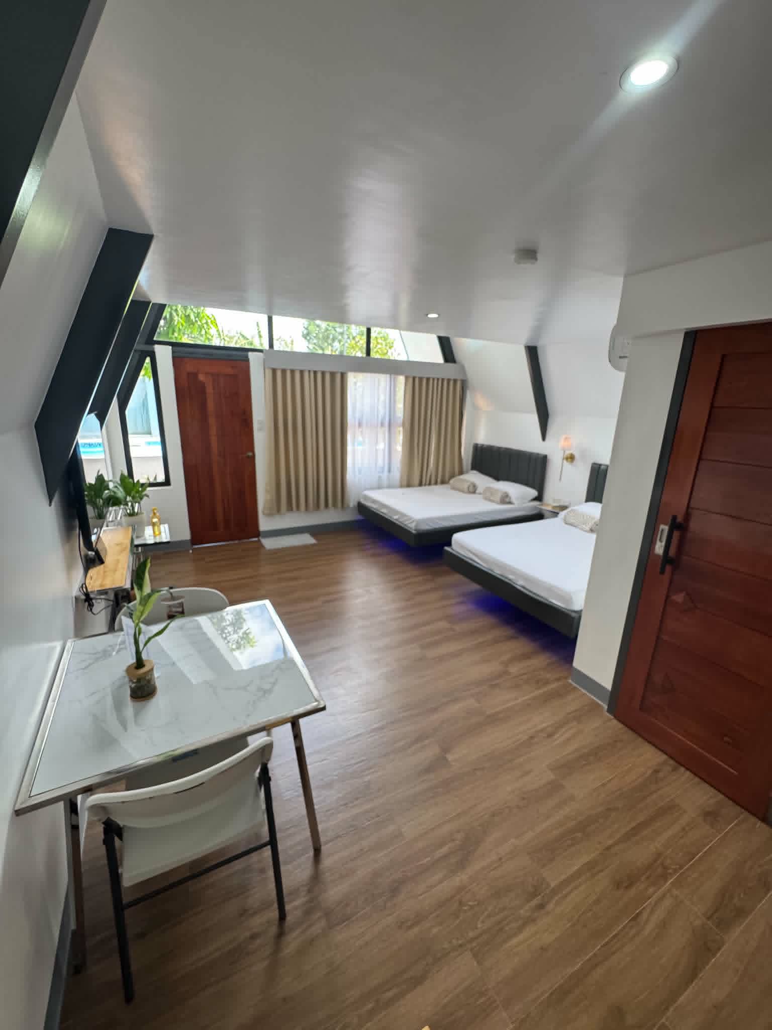 Villa 2 living room with bed and table