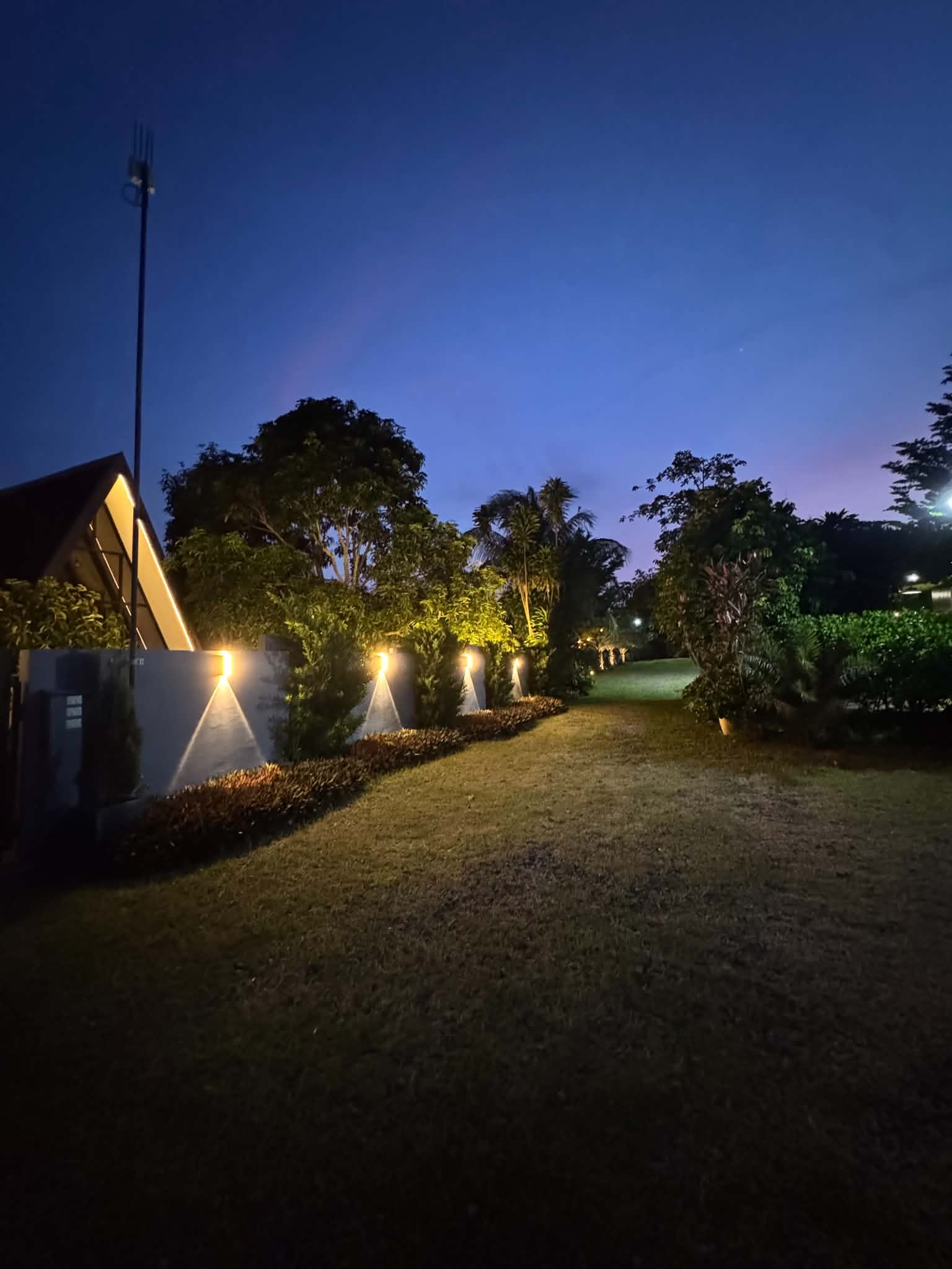 Villa 2 exterior lawn and garden lights at night